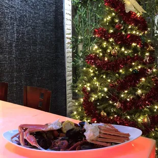 a plate of food and a christmas tree