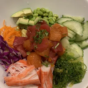 a white bowl filled with different types of food