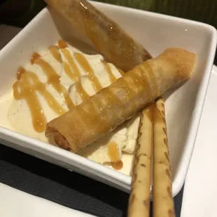a bowl of ice cream and some food
