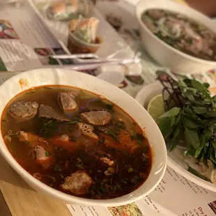 a bowl of soup and a plate of salad