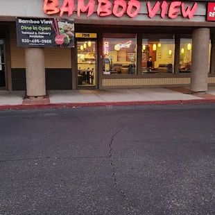the outside of a bamboo view restaurant