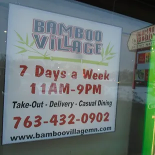 Hours of operation - front window.