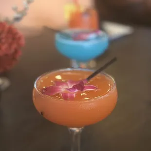 two cocktails on a table