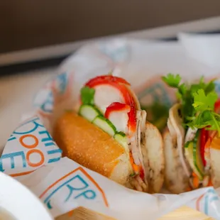 a basket of sandwiches and a bowl of soup