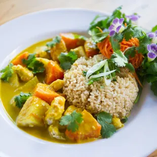 a plate of food with rice and vegetables
