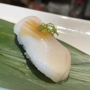 a sushi on a banana leaf