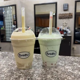 Mango piña colada smoothie with lychee jellies, honeydew smoothie with strawberry bursting boba