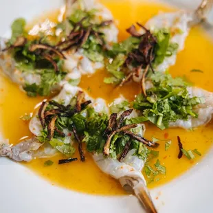a white plate of food on a wooden table