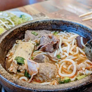 a bowl of noodles and beef