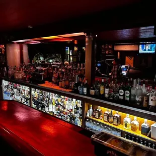 a bar filled with liquor bottles