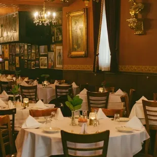 a dining room with tables and chairs