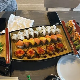 Variety of rolls! Spicy tuna, California roll, sunrise roll, Starlight roll, and Money brain on the right