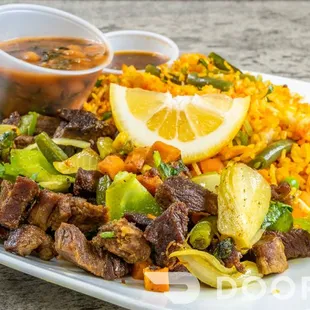 Rice with beef steak (suqaar), served over rice