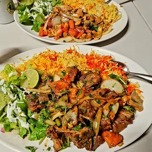 Lamb plate in the front and chicken plate in the back. So good! The very spicy jalapeño green sauce is so good!