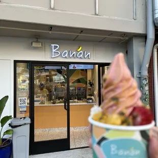 a person holding a bowl of ice cream
