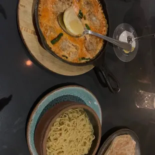 a bowl of soup and a bowl of noodles