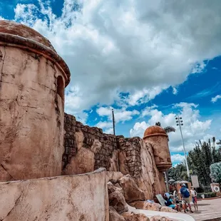 a man and a woman sitting by a pool