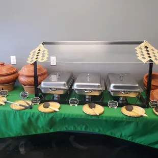 a buffet table with a variety of food items