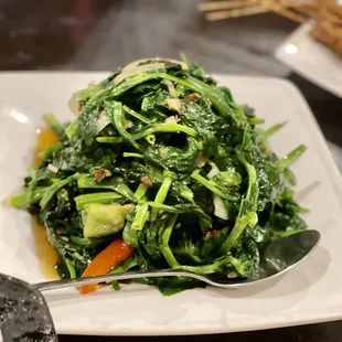 a plate of stir fried vegetables