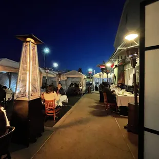 Outdoor seating with lots of heat lamps