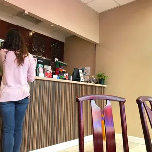 a woman standing at the counter