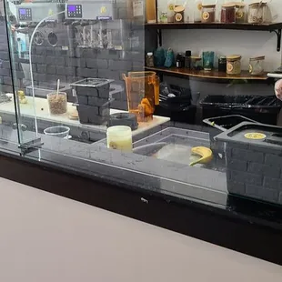 a man standing behind the counter