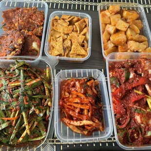 Bottom: Green onion, radish, spicy marinated crab Top: kimchi pancakes, spicy fishcake, potato