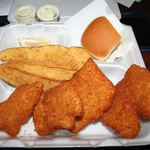 Banda's main attraction.  Fried fish with potato wedges.