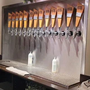 a row of beer taps