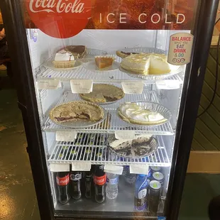 a display case with a variety of food items