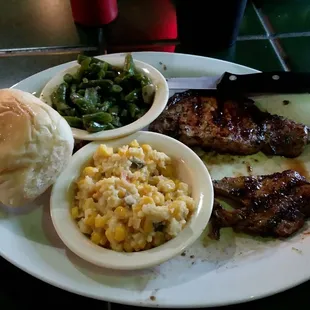 Spicy Chipotle Grilled Pork Chops with green beans, corn casserole and a roll, yummy!