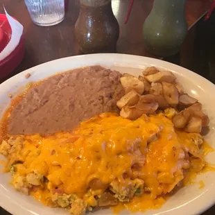 Chiliquiles with cheese and pico, refried beans and potatoes!!