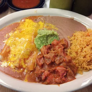 Mexican plate: enchiladas and carne guisada w/rice and beans