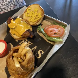 Grill chicken club with onion rings.  If you look close the mustard spells "enjoy." Nice touch.