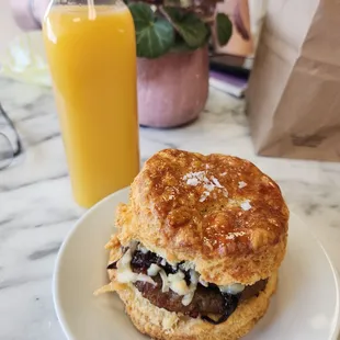 The Sausage Biscuit with an orange juice.