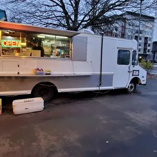 a food truck parked on the side of the road