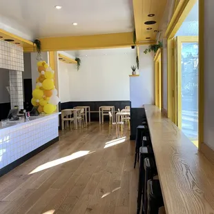 a long table with chairs and a yellow balloon