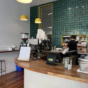 a man working at a coffee shop