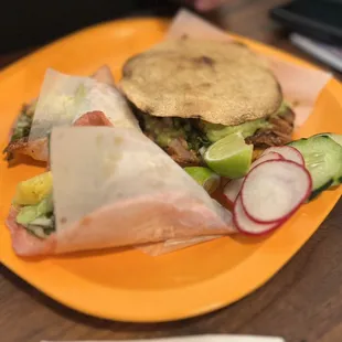 a burrito with a side of vegetables