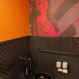 a black toilet in a bathroom