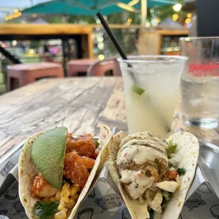 Yummy 78044Sriracha Honey Tofu Taco and 78014Avocado Taco, with a ginger beer on the patio