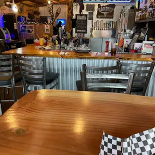 a wooden table and chairs