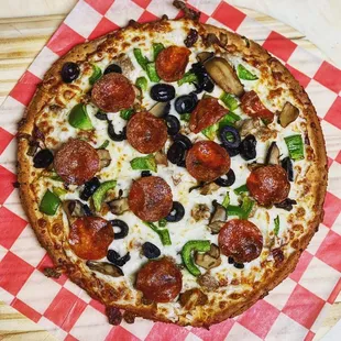 a pizza with pepperoni and olives