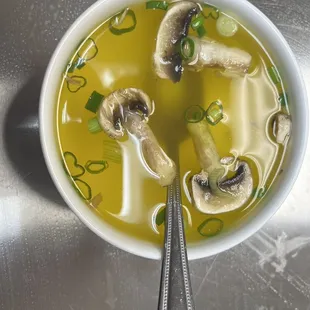 a bowl of soup with mushrooms