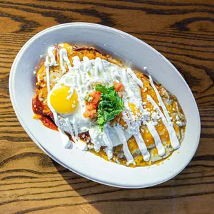 a plate of food on a wooden table