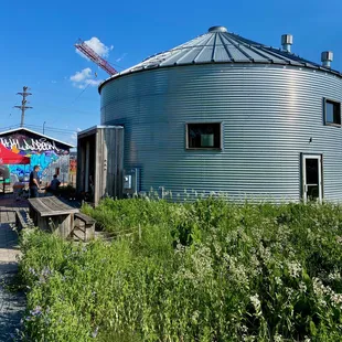 a grain silo and a picnic table