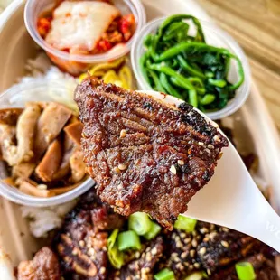 LA Galbi Rice Bowl, with kimchi, eggplant, and spinach! photo by @kerryout_delivery on instagram.