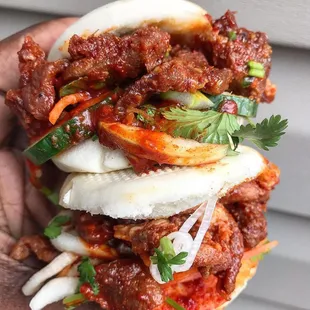 spicy pork bao buns with double pork! photo by @dccheapeats on instagram.