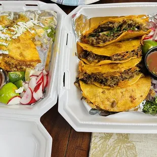  two trays of mexican food