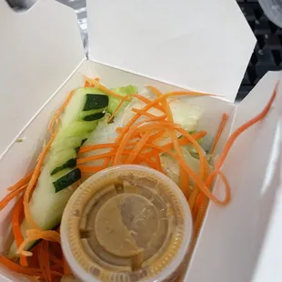 Lunch salad in a paper box